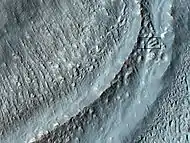 Close-up of the area in the box in the previous image.  This may be called by some the terminal moraine of a glacier.  For scale, the box shows the approximate size of a football field.  Image taken with HiRISE under the HiWish program. Location is Hellas quadrangle.