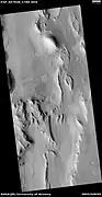 Wide view of layered features, as seen by HiRISE under HiWish program