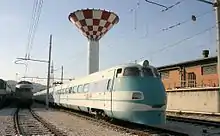 View of an ETR 401 parked at the station depot and of the station tower