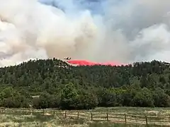 Airplane dropping fire retardant on June 18, 2020