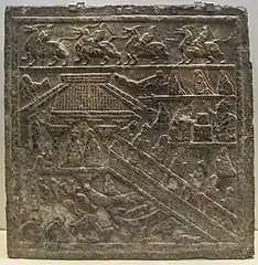 Stone carving from the Eastern Han Dynasty, with depiction of a waterside pavilion overlooking a lake full of fish, turtles, and waterfowl