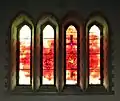The Milllenium Window based on Revelation 22 v5. They need no light of lamp or sun, for the Lord God will be their light, and they will reign for ever and ever. "The sun sets on the city of Swansea but rises in the new Jerusalem"