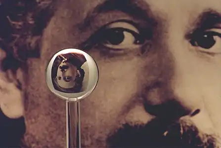 An image of one of the most accurate human-made spheres, as it refracts the image of Einstein in the background. This sphere was a fused quartz gyroscope for the Gravity Probe B experiment, and differs in shape from a perfect sphere by no more than 40 atoms (less than 10&nbsp;nm) of thickness. It was announced on 1 July 2008 that Australian scientists had created even more nearly perfect spheres, accurate to 0.3&nbsp;nm, as part of an international hunt to find a new global standard kilogram.