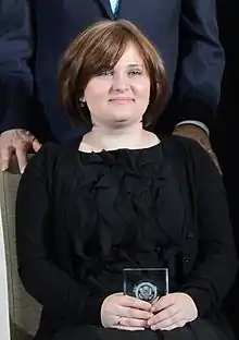 Milashina with her International Women of Courage Award at the 2013 awards ceremony