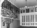 The lobby/entrance to the theatre with photos of actors who appeared at the theatre. c. 1930-1940.