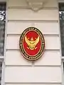 Plaque outside the embassy showing the Emblem of Thailand