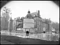 Southeastern view of the château surrounded by a moat, c. 1900-1920