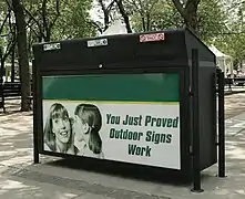 Recycling bin featuring advertising in Toronto, Ontario, Canada