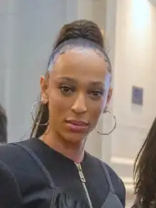 Hilton looking toward the camera