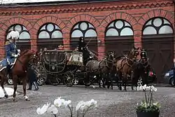 The State Coach at the Royal Stables.
