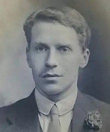 Black and white photograph of young man, aged around 18, with flower in buttonhole, wispy short moustache, Ewart Horsfall in around 1910