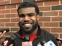 Ezekiel Elliott picture while being questioned by reporters in 2015 when he played for Ohio State