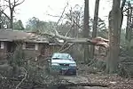 This house only sustained minor loss of shingles. Though well-built structures are typically unscathed by F0 tornadoes, falling trees and tree branches can injure and kill people, even inside a sturdy structure.