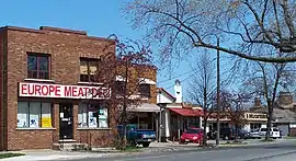 The small delicatessens and independent businesses that line Facer St.