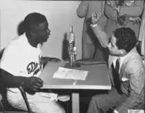 Jackie Robinson interviews Faisal II during his visit to the United States, 1952