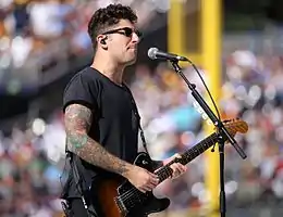 Trohman performing with Fall Out Boy in 2016