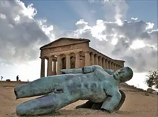 Icarus in front of Temple of Concordia in the Valle dei Templi, Agrigento, Italy.