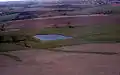 Aerial view of pond on farm land