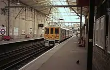 Farringdon station with a Class 319 on a Thameslink service.