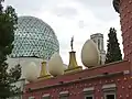 Image 11The Dalí Theatre and Museum, commemorating Salvador Dalí in his home town of Figueres, Catalonia, has a geodesic dome and is decorated with giant eggs.