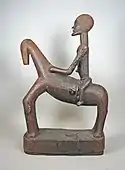 Equestrian figure; 16th–17th century; wood; height: 68.9&nbsp;cm (27.mw-parser-output .frac{white-space:nowrap}.mw-parser-output .frac .num,.mw-parser-output .frac .den{font-size:80%;line-height:0;vertical-align:super}.mw-parser-output .frac .den{vertical-align:sub}.mw-parser-output .sr-only{border:0;clip:rect(0,0,0,0);clip-path:polygon(0px 0px,0px 0px,0px 0px);height:1px;margin:-1px;overflow:hidden;padding:0;position:absolute;width:1px}1⁄8 in.); Metropolitan Museum of Art