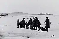 A White firing squad executes Red prisoners (photo taken by Harald Netvig).