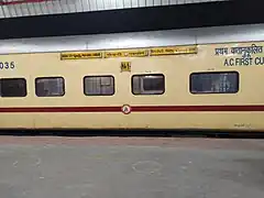 A yellow ICF coach used on the Nauchandi Express