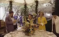 Ford and Social Secretary Maria Downs give the media a tour of the tent erected in the South Lawn for the July 1976 state dinner honoring Queen Elizabeth II and Prince Philip of Great Britain