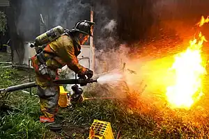 Firefighter putting out fire