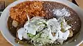 Chicken enchilada with rice and beans