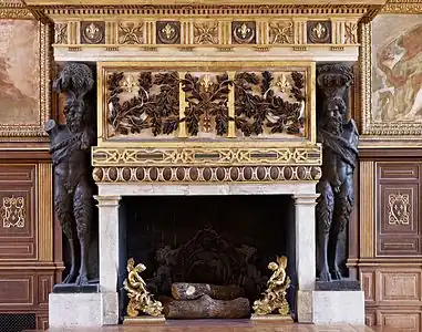 Renaissance fireplace with atlantes in the ballroom of the Palace of Fontainebleau, Fontainebleau, France
