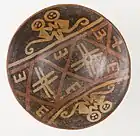 Footed bowl depicting a pair of monkeys; 750–1250; resist-painted ceramic; height: 8.9&nbsp;cm (3.mw-parser-output .frac{white-space:nowrap}.mw-parser-output .frac .num,.mw-parser-output .frac .den{font-size:80%;line-height:0;vertical-align:super}.mw-parser-output .frac .den{vertical-align:sub}.mw-parser-output .sr-only{border:0;clip:rect(0,0,0,0);clip-path:polygon(0px 0px,0px 0px,0px 0px);height:1px;margin:-1px;overflow:hidden;padding:0;position:absolute;width:1px}1⁄2 in.), diameter of the bowl: 20.48&nbsp;cm (8.mw-parser-output .frac{white-space:nowrap}.mw-parser-output .frac .num,.mw-parser-output .frac .den{font-size:80%;line-height:0;vertical-align:super}.mw-parser-output .frac .den{vertical-align:sub}.mw-parser-output .sr-only{border:0;clip:rect(0,0,0,0);clip-path:polygon(0px 0px,0px 0px,0px 0px);height:1px;margin:-1px;overflow:hidden;padding:0;position:absolute;width:1px}1⁄16 in.), diameter of the foot: 7.94&nbsp;cm (3.mw-parser-output .frac{white-space:nowrap}.mw-parser-output .frac .num,.mw-parser-output .frac .den{font-size:80%;line-height:0;vertical-align:super}.mw-parser-output .frac .den{vertical-align:sub}.mw-parser-output .sr-only{border:0;clip:rect(0,0,0,0);clip-path:polygon(0px 0px,0px 0px,0px 0px);height:1px;margin:-1px;overflow:hidden;padding:0;position:absolute;width:1px}1⁄8 in.); Los Angeles County Museum of Art (USA)