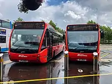 Foyle Metro Optare Versas no. 1828 and 1823 parked at a bus stop.