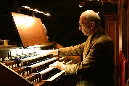 François-Henri Houbart, the current organist in 2022, at the keyboard in 2011