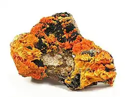 Francevillite (orange) with Curienite  (yellow) and Chervetite, Mounana Mine, Franceville, Haut-Ogooué Province, Gabon. Overall size 8.7 x 6.1 x 2.1&nbsp;cm.