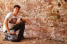 Image of Frank Weaver with petroglyphs in Paraguay