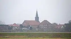 Panorama of the town in the early morning fog