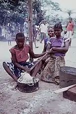 Young women preparing pounded yam (which includes mashed and pounded yam flour) in the Democratic Republic of Congo.