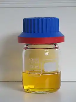 40-milliliter container of red fuming nitric acid