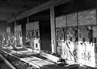 Furnace room in crematory II, Auschwitz-Birkenau. The picture was taken by the SS before finishing the building in June 1943. Most furnaces and crematoria were supplied by Topf and Sons.