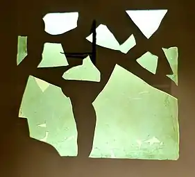 Fragment of a Roman window glass plate dated to 1st to 4th century AD. Note the obvious curvature; this is not a flat pane