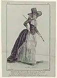 A drawing of a veiled woman in a big purple hat and a purple, long-sleeved redingote: a coat that is fitted at the bodice and hits above the hips at the front but cut so that it is left long in the back so that it reaches the floor. Under the coat is a white, floor-length gown. She is carrying a riding crop.