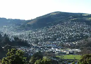 Looking across the Gardens Corner at the mouth of North East Valley towards Ōpoho from Prospect Park