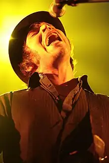 Coombes performing with Supergrass in London in 2008