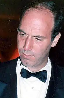 Color photo of a man in a tuxedo.