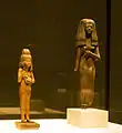 Figure of a girl with a cat and standing figure of a young woman, 18th Dynasty, c. 1380 and 19. Dynasty, Abusir el Meleq and Thebes
