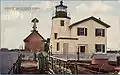 Postcard c.1905 of the Newport Harbor Light with the 1864 keeper's house still attached