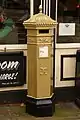 Gold postbox in Lincoln, painted in honour of the gold medal won by Sophie Wells
