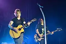 Goo Goo Dolls in 2013. From left to right: John Rzeznik, Robby Takac