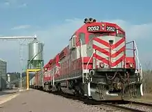 A Wisconsin and Southern grain train loads at a co-op in Rock Springs, Wisconsin